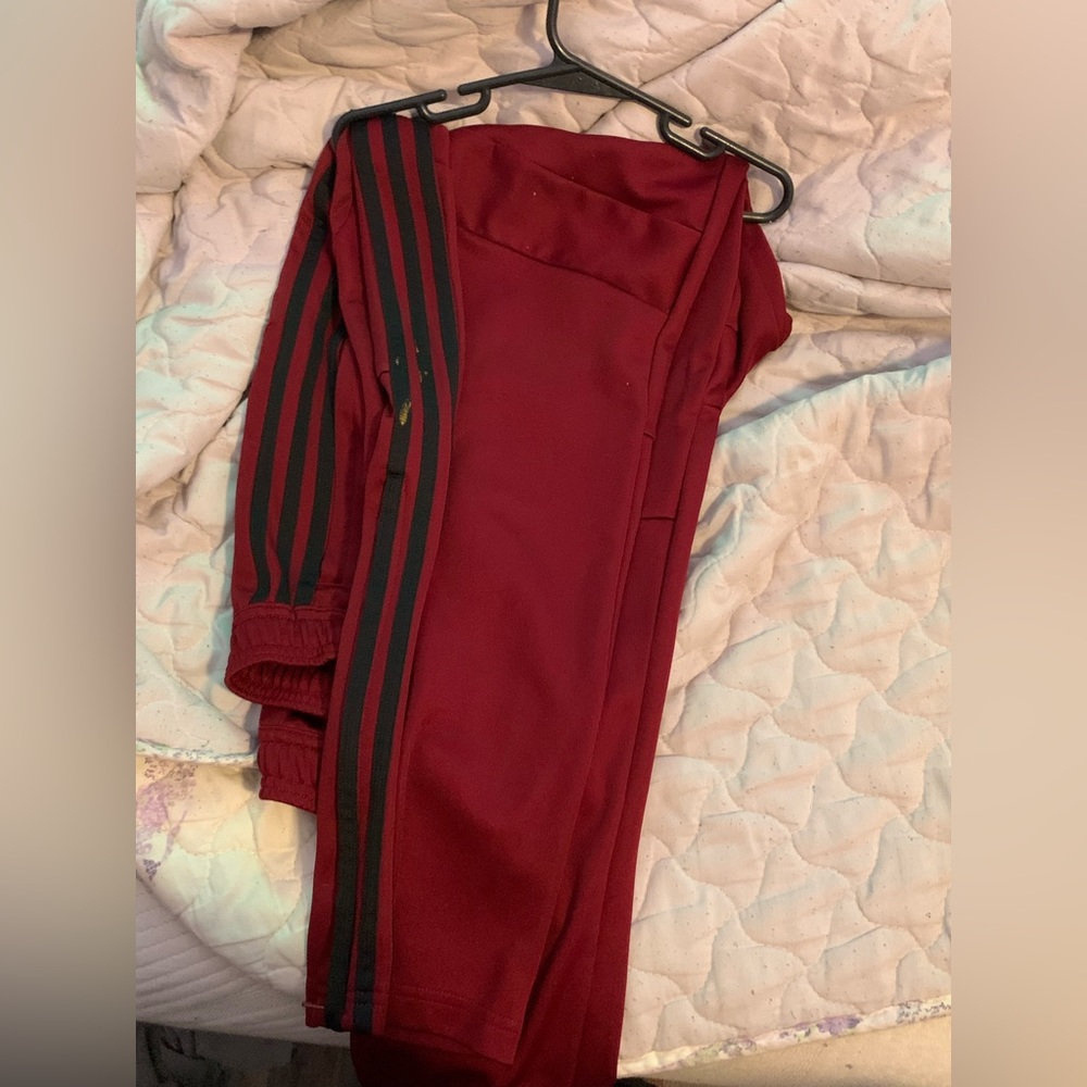Red and black adidas track pants